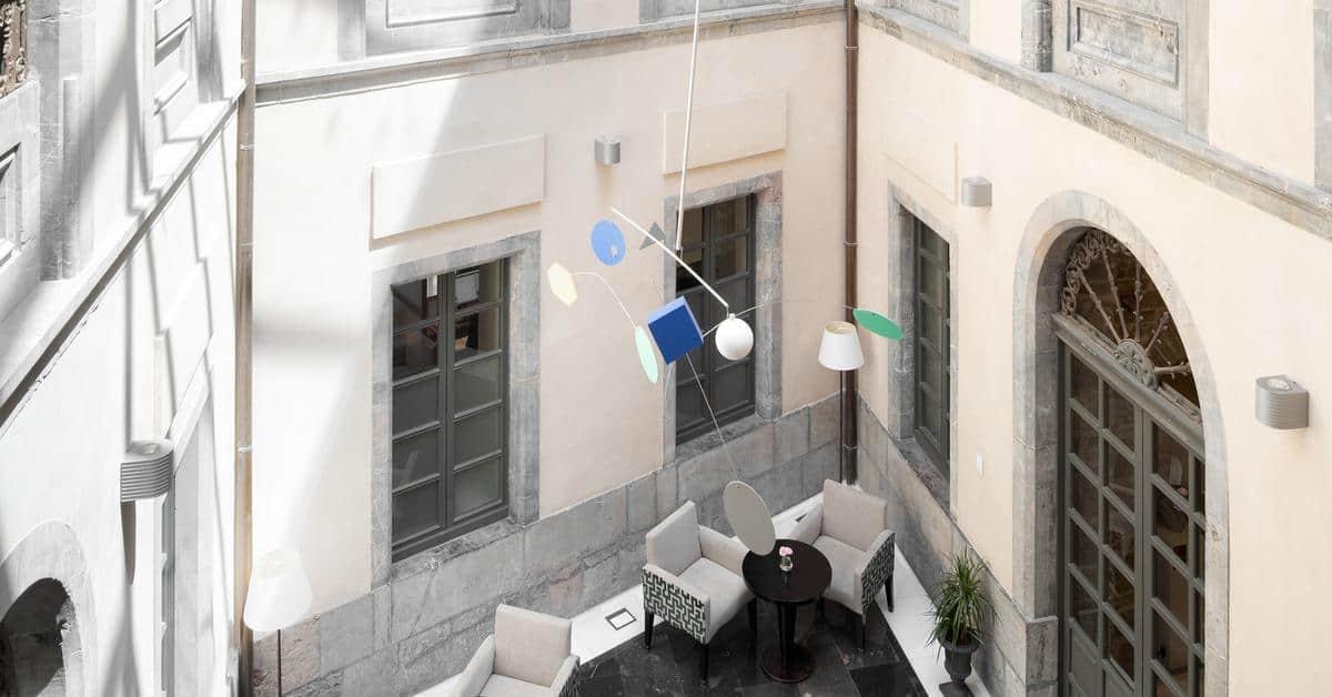 Palacio De Aviles Affiliated By Melia Екстериор снимка The mobile in the lobby of the National Gallery of Greece